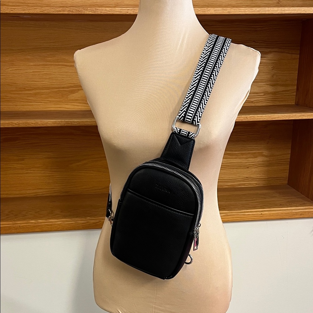 Elegant Black Crossbody Bag with Patterned Strap